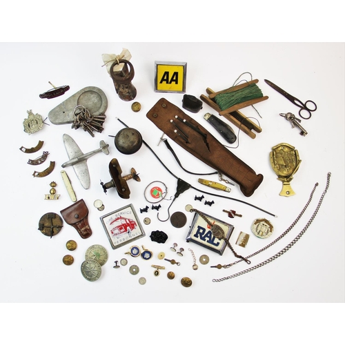 224 - A collection of vintage ephemera to include, an alloy model of a Spitfire, assorted tunic buttons, a... 