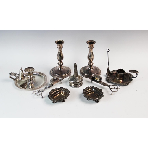 79 - A collection of early 20th century and later silver plated wares comprising: a pair of candlesticks,... 