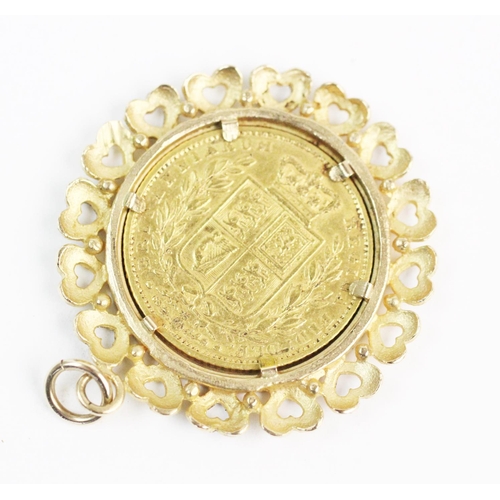 94 - A Victorian shield back sovereign dated 1864, set in a 9ct gold pierced heart motif border, 3.4cm di... 