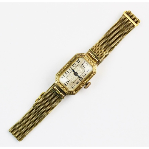 125 - A lady's Art Deco 18ct gold wristwatch, dial with engraved floral decorative panel to centre, black ... 