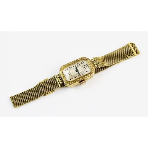 125 - A lady's Art Deco 18ct gold wristwatch, dial with engraved floral decorative panel to centre, black ... 