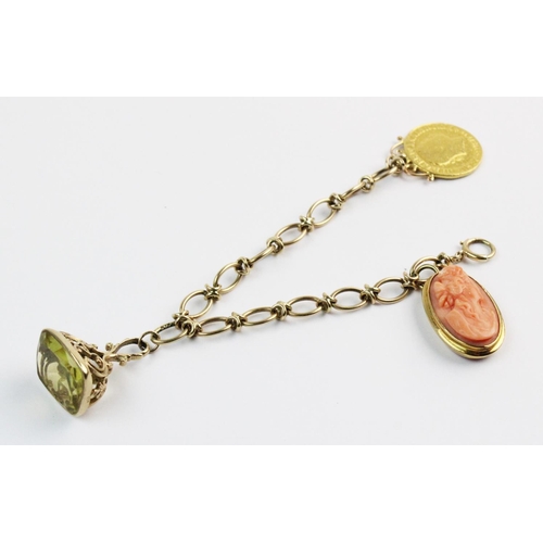 170 - A yellow metal bracelet with assorted charms, the mixed link bracelet stamped '9ct' measuring approx... 