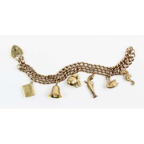 172 - A 9ct gold double-row charm bracelet, comprising a double row curb link chain measuring 18cm, each l... 