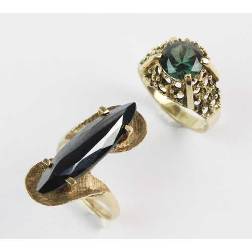 198 - A 9ct gold green stone set dress ring, the central round brilliant untested green stone, measuring 8... 