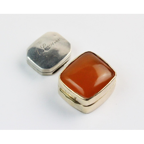 67 - A George IV gold coloured pill box, of rounded rectangular form, hinged lid set with an amber colour... 