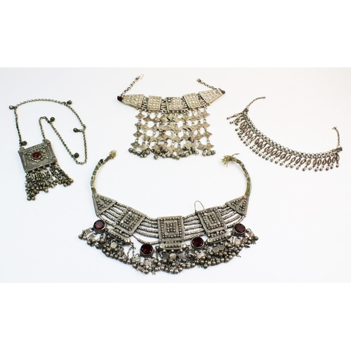 174 - A selection of Yemeni-style wedding jewellery, to include a white metal fringed collarette with appl... 