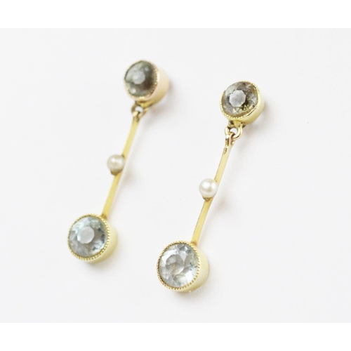 166 - A pair of Edwardian aquamarine and seed pearl set drop earrings, each comprising a round mixed cut a... 