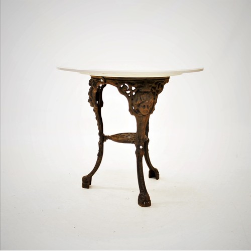 935 - A Britannia cast iron pub table, 20th century, the circular painted hardwood top raised upon three o... 