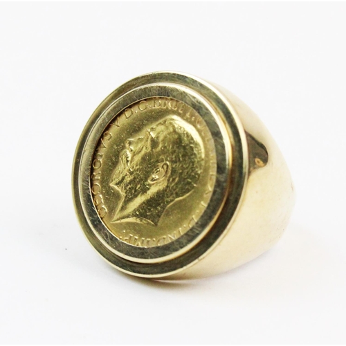 102 - A George V sovereign dated 1911, set to a 9ct gold gentlemen's dress ring of tapering form, ring siz... 