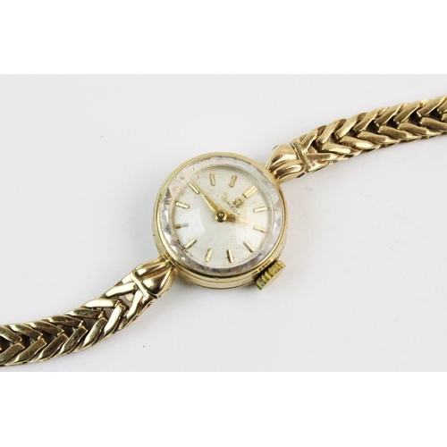 133 - A lady's 9ct gold vintage Omega wristwatch, the cream coloured dial with gold-toned baton markers, s... 