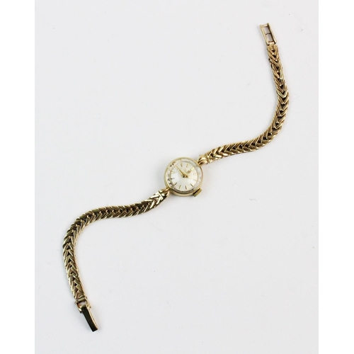 133 - A lady's 9ct gold vintage Omega wristwatch, the cream coloured dial with gold-toned baton markers, s... 