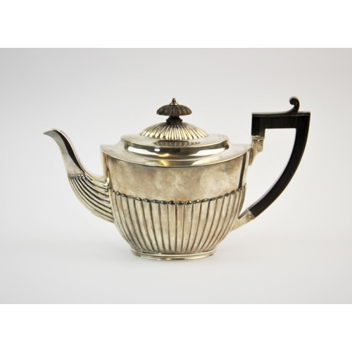 2 - A Victorian silver teapot, Charles Stuart Harris, London 1888, of typical form, the half reeded body... 