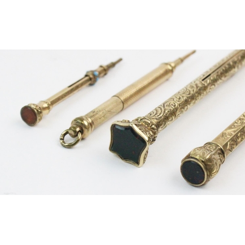 21 - A bloodstone set propelling pencil, the cylindrical body with engraved floral detail and a bloodston... 