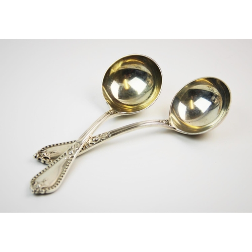 24 - A pair of Victorian silver ladles, Goldsmiths' Alliance Ltd, London 1888, with plain polished bowls,... 