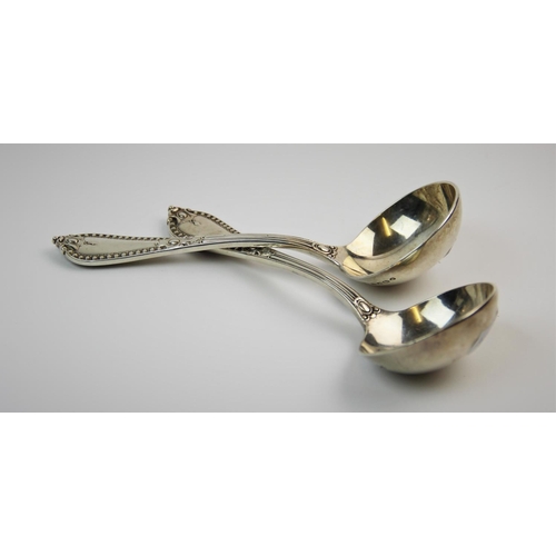 24 - A pair of Victorian silver ladles, Goldsmiths' Alliance Ltd, London 1888, with plain polished bowls,... 