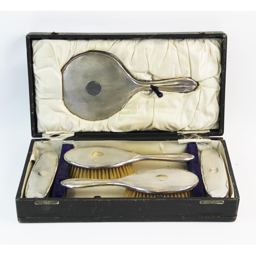 26 - A George V silver back dressing table set, F R Gomm, Birmingham 1919, comprising; a hand mirror, two... 