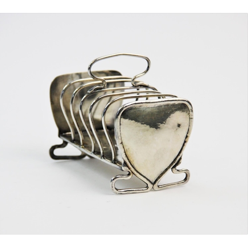31 - An Art Nouveau silver toast rack, Keswick School of Industrial Art, Chester 1906, the six slice rack... 