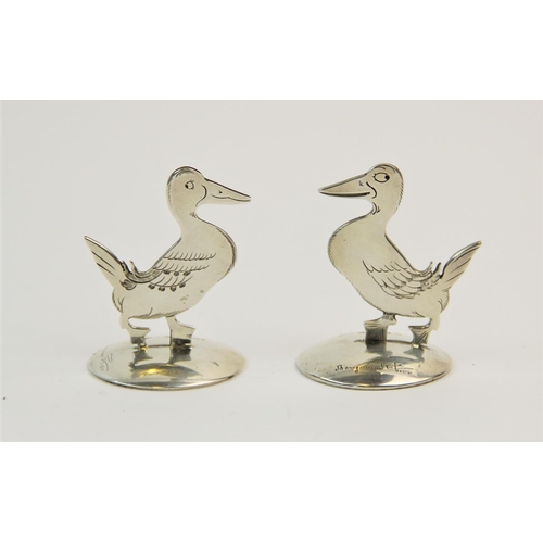 41 - A pair of silver place card holders, Sampson Mordan & Co Ltd, Chester 1912/1914, each modelled as a ... 