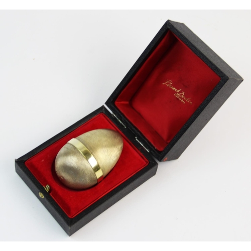 54 - A novelty silver gilt surprise Easter egg, Stuart Devlin, London 1978, no. 50/100, the wrythen body ... 