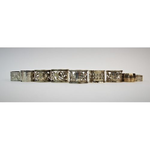 68 - A selection of silver and silver coloured napkin rings, to include, a silver napkin ring, Henry Grif... 