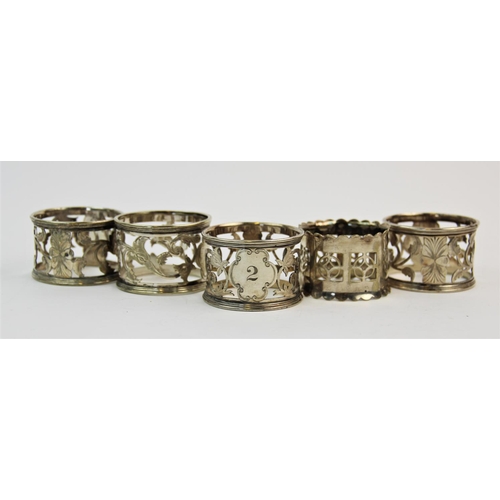 68 - A selection of silver and silver coloured napkin rings, to include, a silver napkin ring, Henry Grif... 