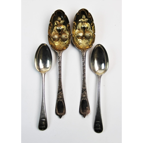 73 - A pair of silver spoons, maker mark 'JJ', London 1739, with urn cast terminals and beaded rims, each... 