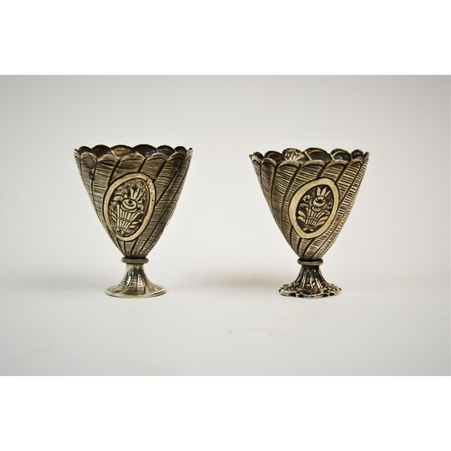 74 - A pair of Turkish silver zarf, pre. 1923 mark, each of typical form and embossed with baskets of flo... 