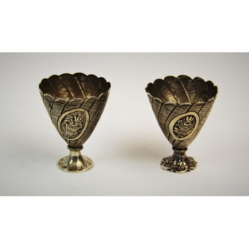 74 - A pair of Turkish silver zarf, pre. 1923 mark, each of typical form and embossed with baskets of flo... 