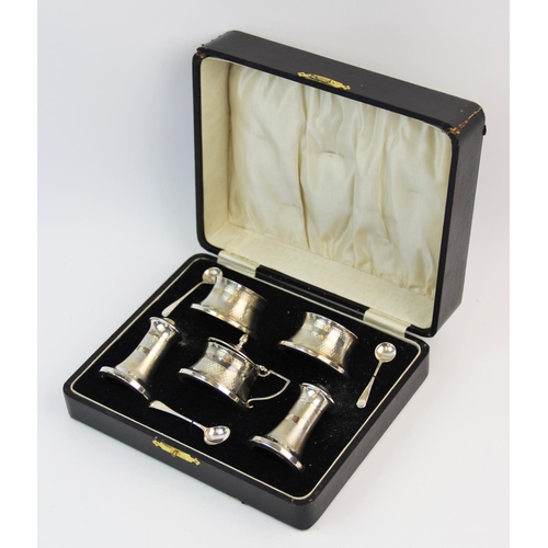 78 - A silver Art Deco condiment set, Joseph Gloster Ltd, Birmingham 1934, each piece of waisted form, wi... 