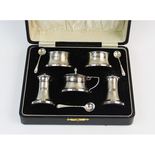 78 - A silver Art Deco condiment set, Joseph Gloster Ltd, Birmingham 1934, each piece of waisted form, wi... 