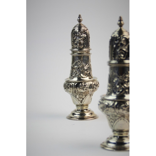 8 - A pair of Victorian silver sugar casters, William Aitken, Chester 1900, each of baluster form, decor... 