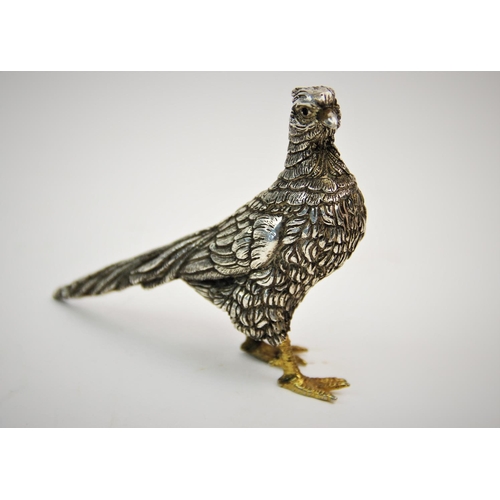 80 - A white metal pheasant, the feather body decorated with striated details and gilt feet, stamped '925... 