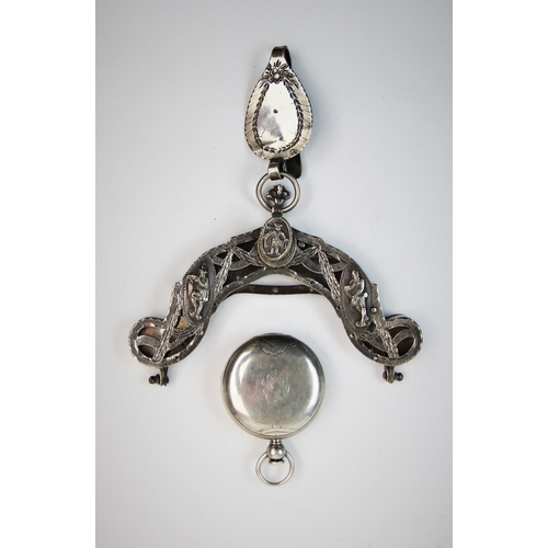 83 - A late 19th century continental white metal purse clasp, decorated with three figural panels, amidst... 