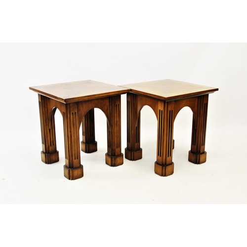 857 - A pair of Gothic influence oak lamp or side tables, 20th century, the square tops centred with a cro... 