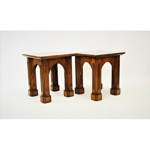 857 - A pair of Gothic influence oak lamp or side tables, 20th century, the square tops centred with a cro... 