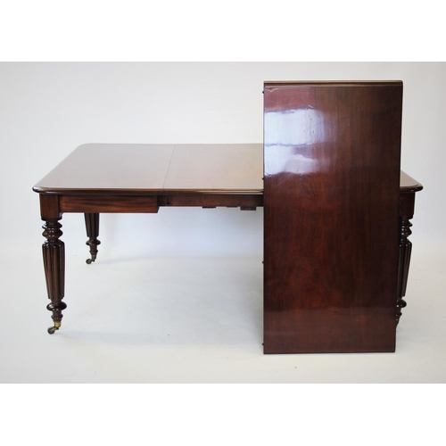 871 - A Victorian mahogany extending dining table, the rectangular moulded top with rounded corners, above... 