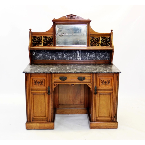 875 - A late Victorian walnut tile back washstand by Lamb of Manchester, with an architectural pediment ab... 