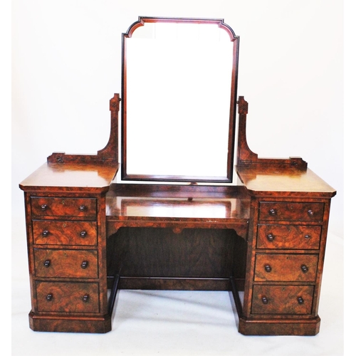 876 - A Victorian burr walnut twin pedestal dressing table, with a shaped mirror above a dropped centre fl... 