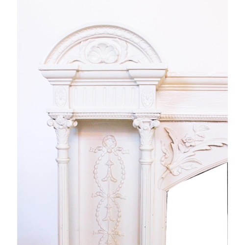 886 - An Edwardian painted overmantle mirror, with central arched pediment above the arched bevelled mirro... 