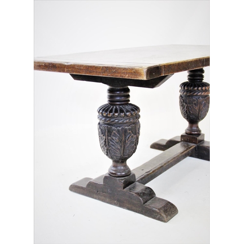 900 - A 17th century style refectory table, early 20th century, the rectangular cleated slab top raised up... 