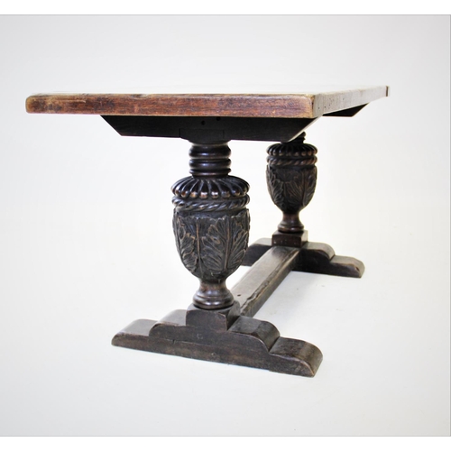 900 - A 17th century style refectory table, early 20th century, the rectangular cleated slab top raised up... 