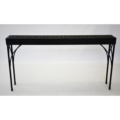 927 - A cast iron garden or conservatory table, of narrow rectangular form, with a pair of cast open work ... 