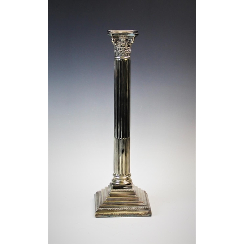 93 - An early 20th century silver plated candlestick, designed as a Corinthian capital, atop a stop-flute... 