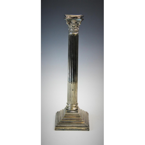 93 - An early 20th century silver plated candlestick, designed as a Corinthian capital, atop a stop-flute... 