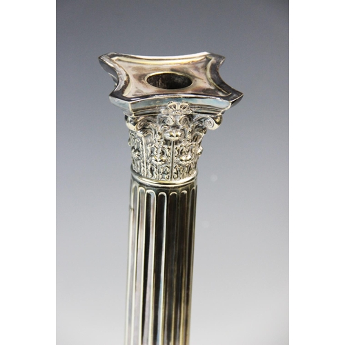 93 - An early 20th century silver plated candlestick, designed as a Corinthian capital, atop a stop-flute... 