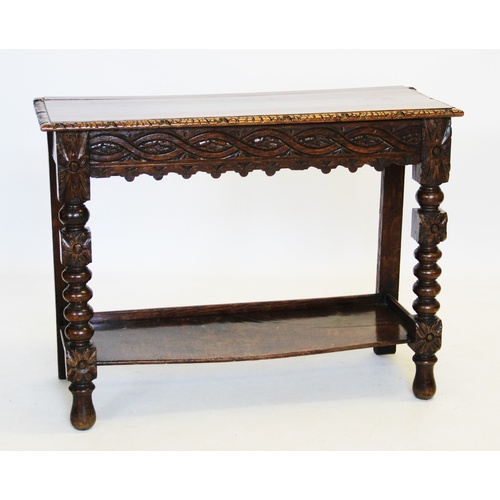 860 - A Victorian carved oak side table, the rectangular moulded top above a frieze carved with a geometri... 