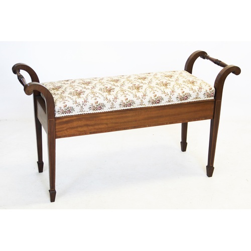 916 - An Edwardian mahogany duet stool, the rectangular upholstered seat flanked by turned hand rails, abo... 