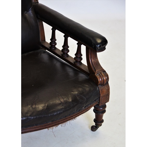 889 - A William IV mahogany and leather drawing room chair, with a button padded back above padded arms ra... 