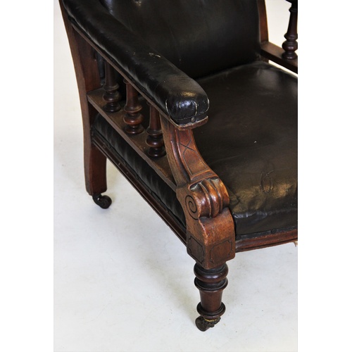 889 - A William IV mahogany and leather drawing room chair, with a button padded back above padded arms ra... 