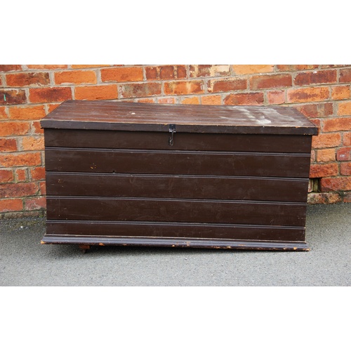 920 - An early 20th century painted pine slatted trunk, applied with side swing handles and moulded plinth... 